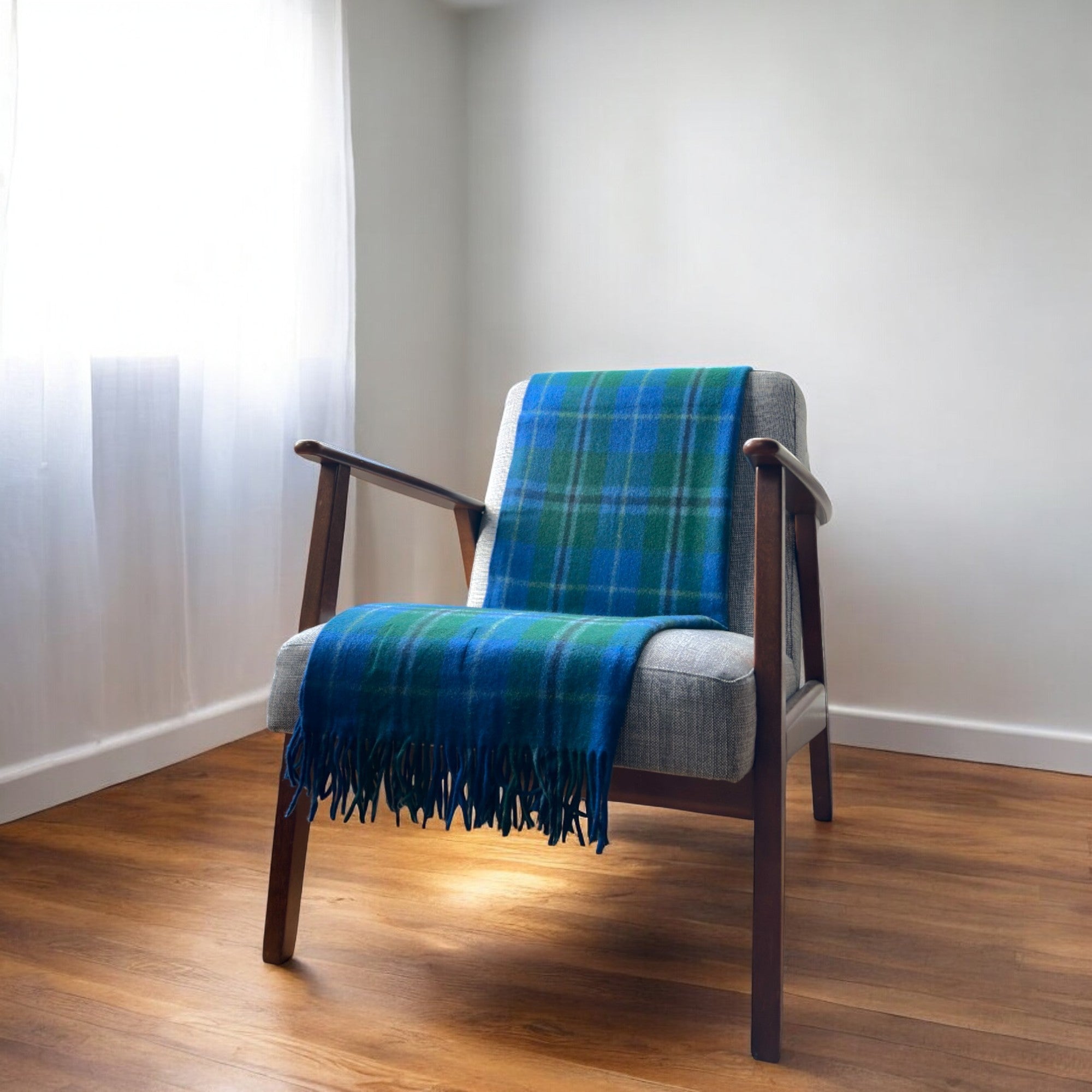 a douglas knee blanket draped over a chair in a cosy room