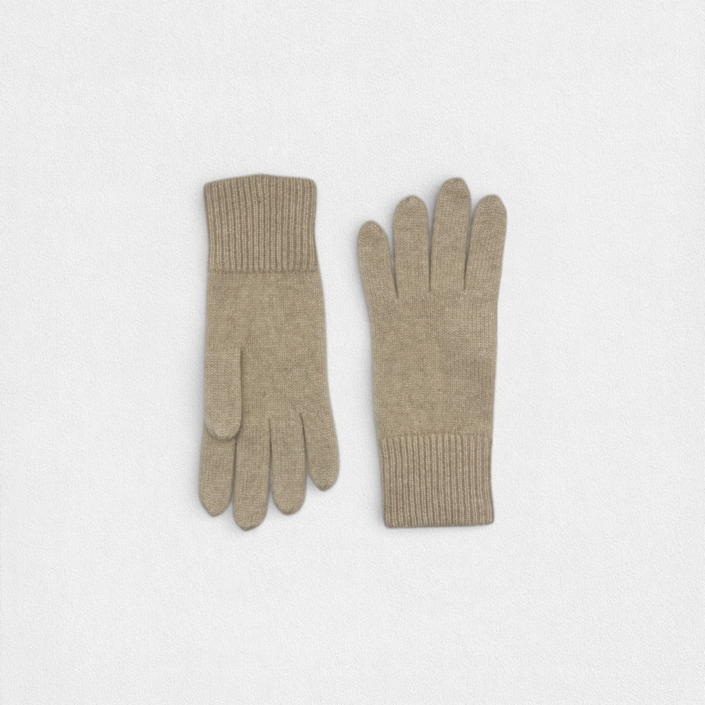 Pair of beige gloves on a white background