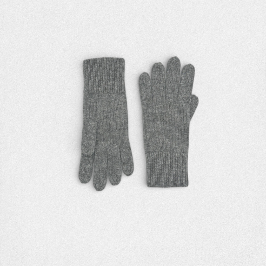 Pair of grey cashmere gloves on a white background 