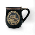 A black stoneware mug with a detailed Edinburgh Castle design and the text 'Edinburgh Castle' around the circumference.
