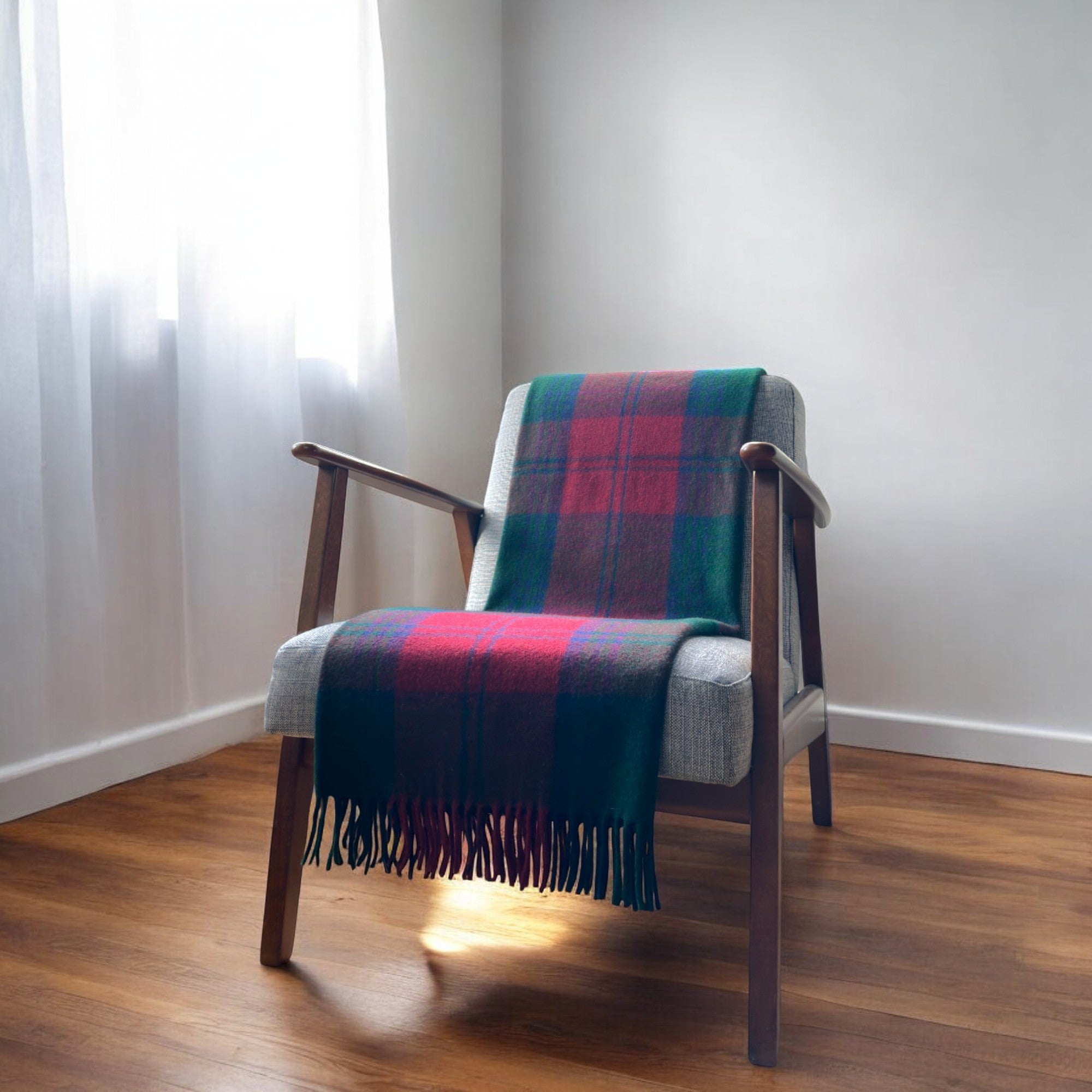 a lindsay knee blanket draped over a chair in a cosy room