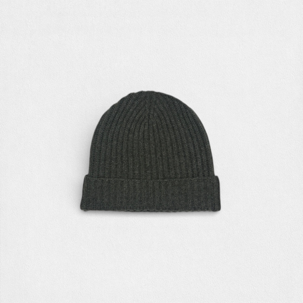 Dark gray knit beanie on a light gray background