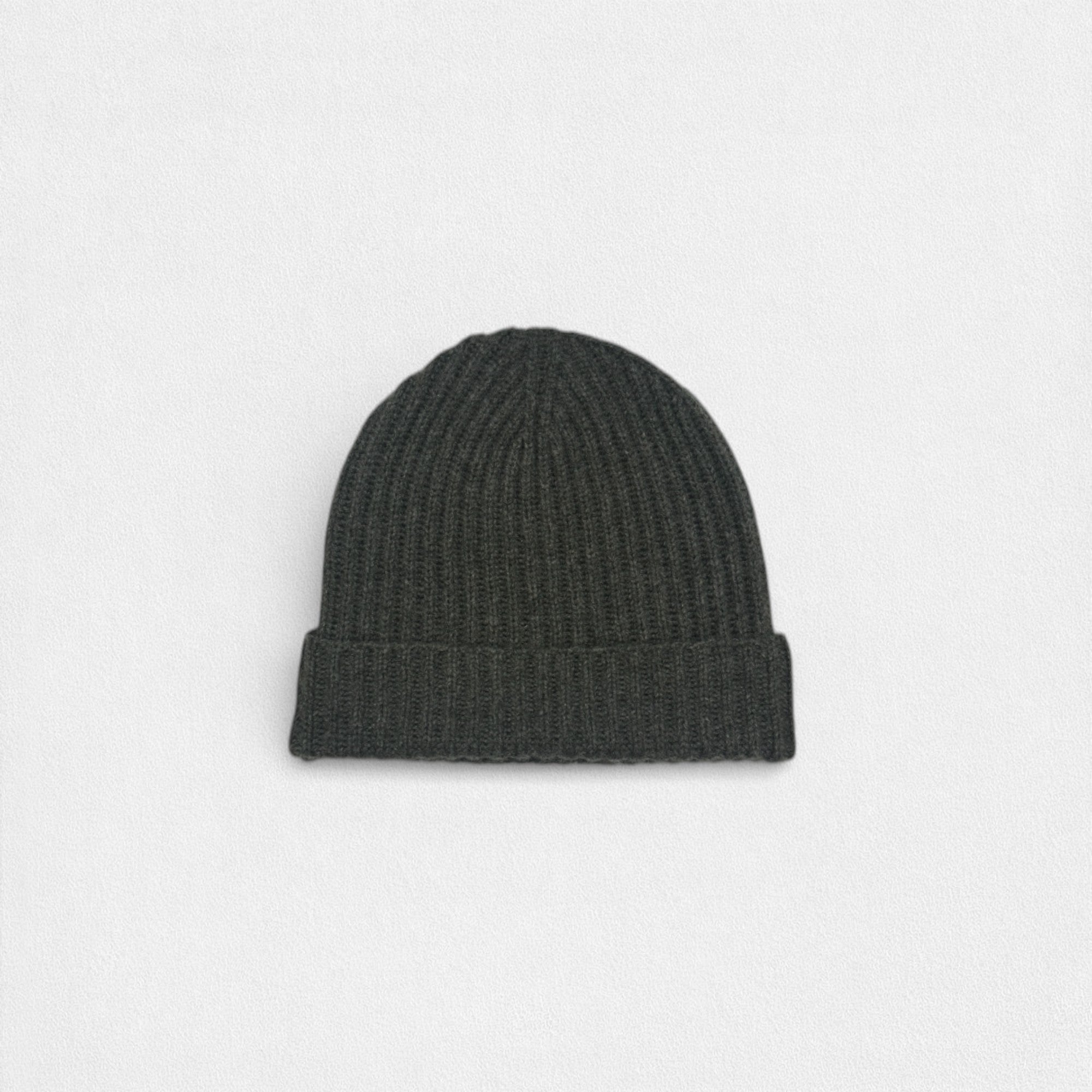 Dark gray knit beanie on a light gray background