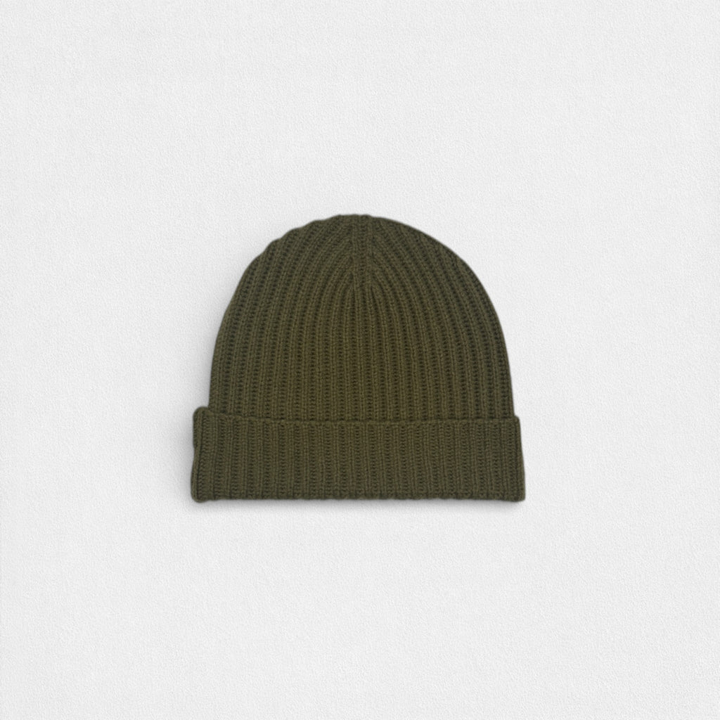 Green beanie on a light gray background