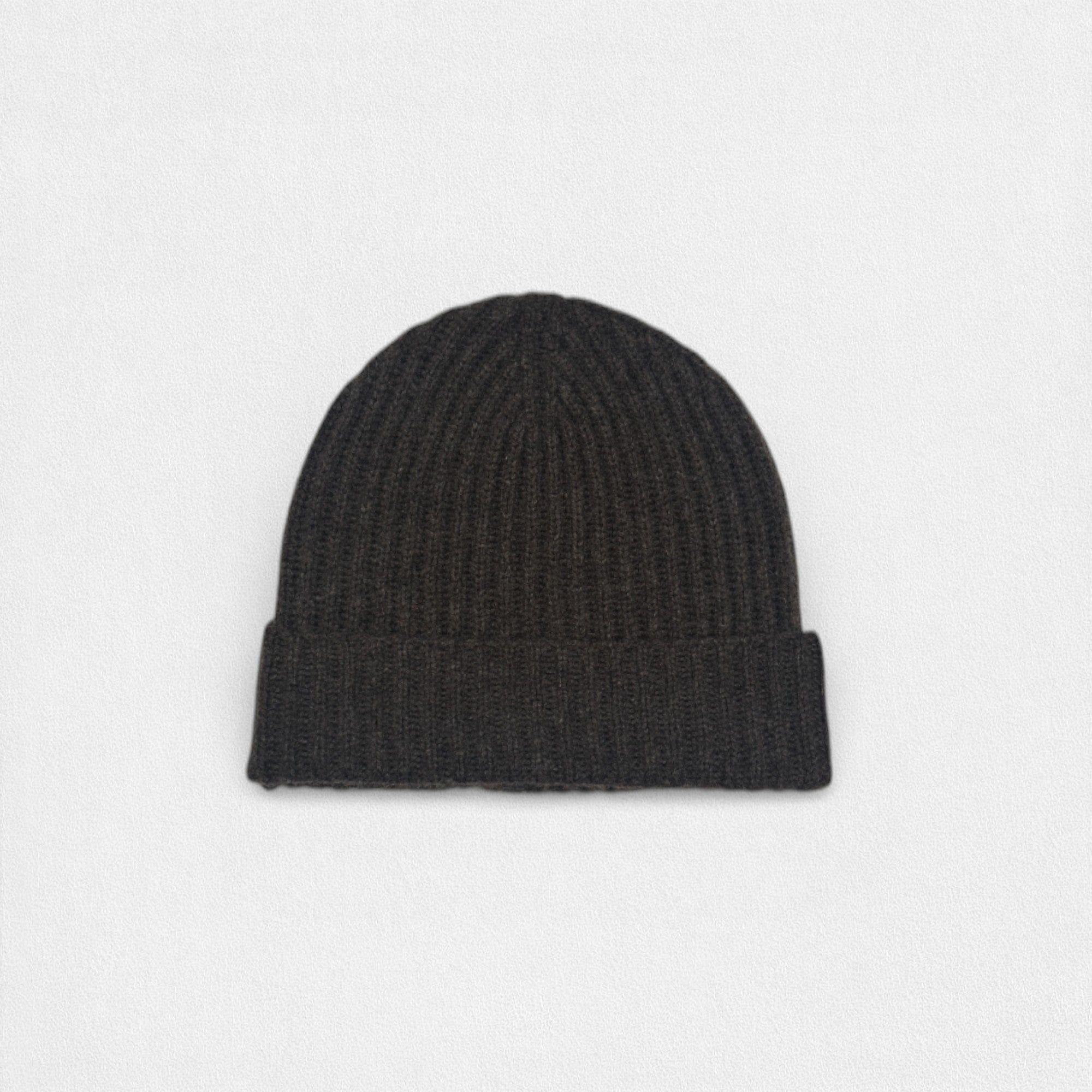 Black knit beanie on a light gray background