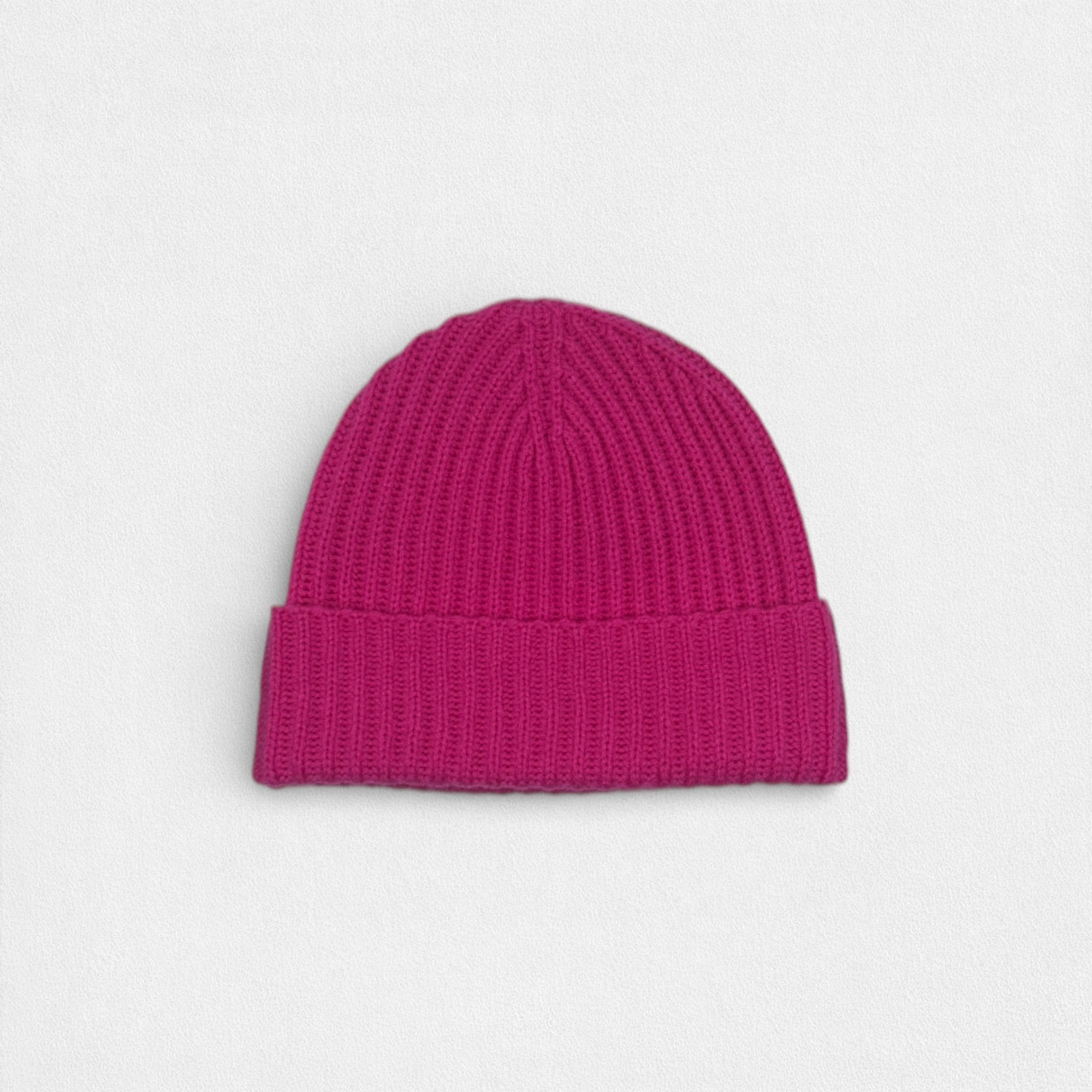 Vibrant Pink knit beanie on a light gray background