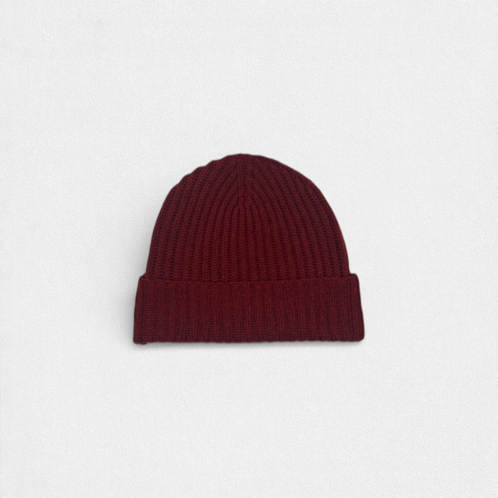 Maroon beanie on a light gray background